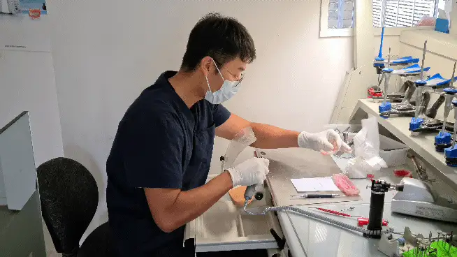Dental technician at work in the Stanmore Bay Denture lab